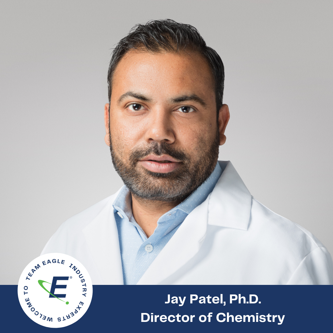 Text reads, "Welcome to the Team Eagle Industry Expert Jay Patel, Ph.D., Director of Chemistry." Dr. Patel is smiling while wearing a white Eagle branded lab coat.