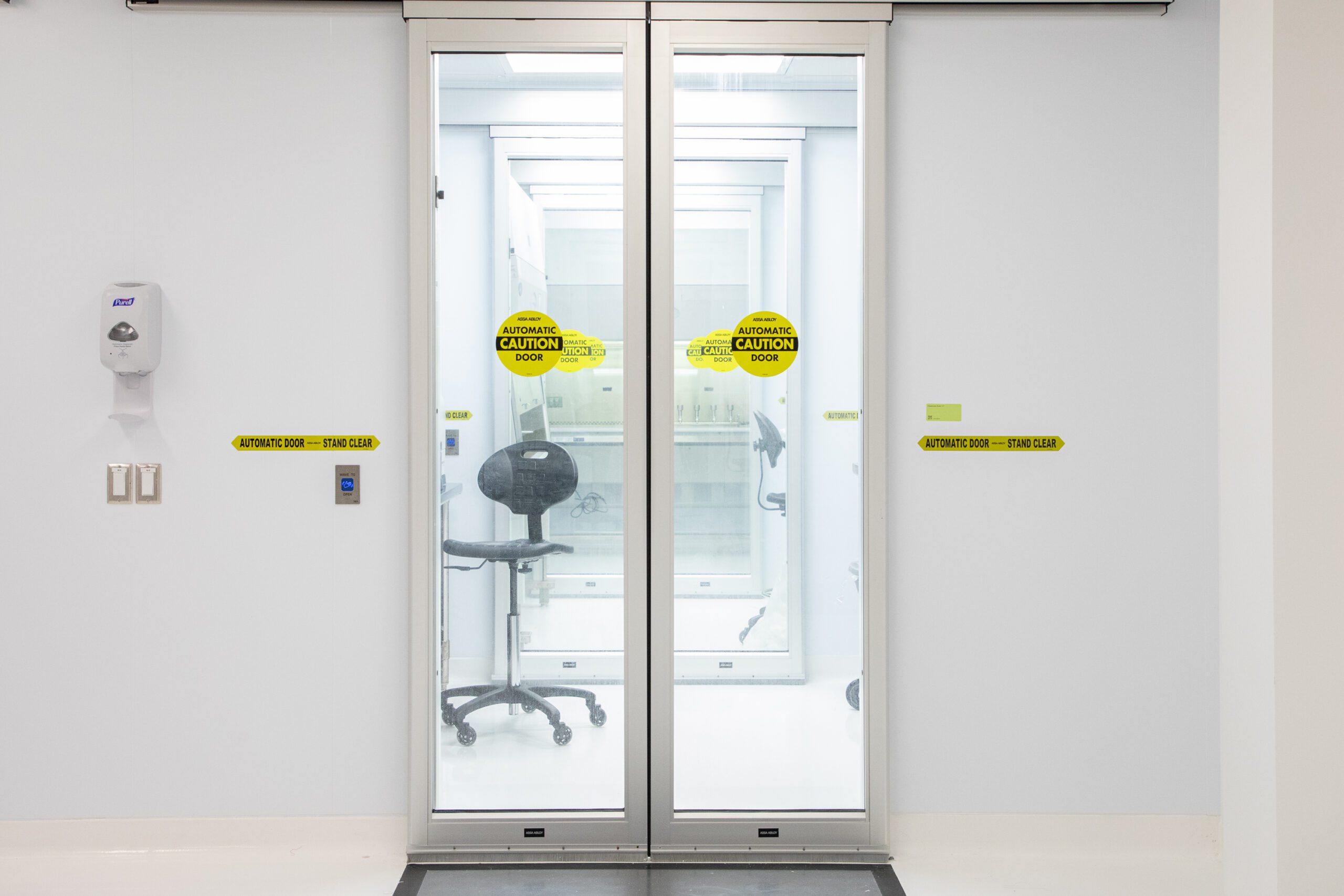 Image of glass doors leading to Eagle's Microbiology laboratory cleanroom