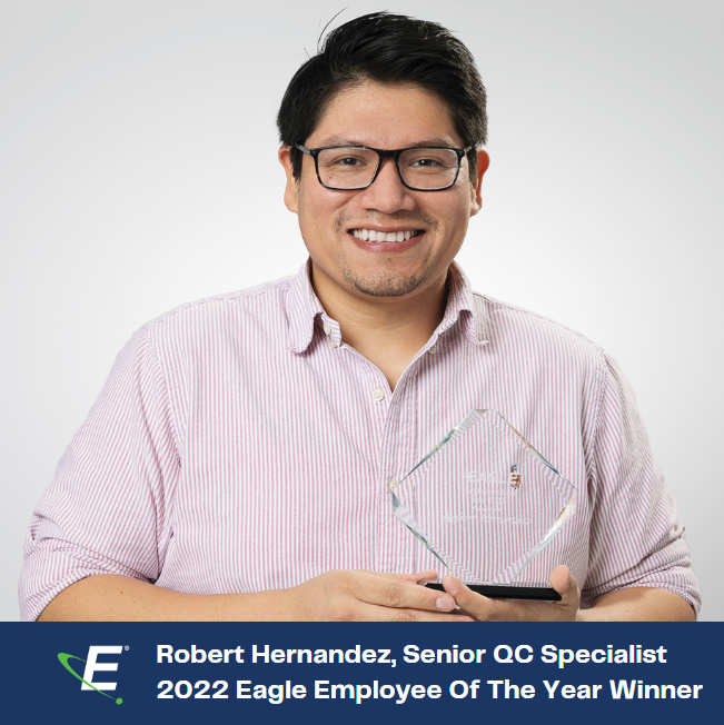 Text states, "Robert Hernandez, Senior QC Specialist, 2022 Eagle Employee Of The Year." An image of Robert smiling while holding a glass, damiond shaped award.