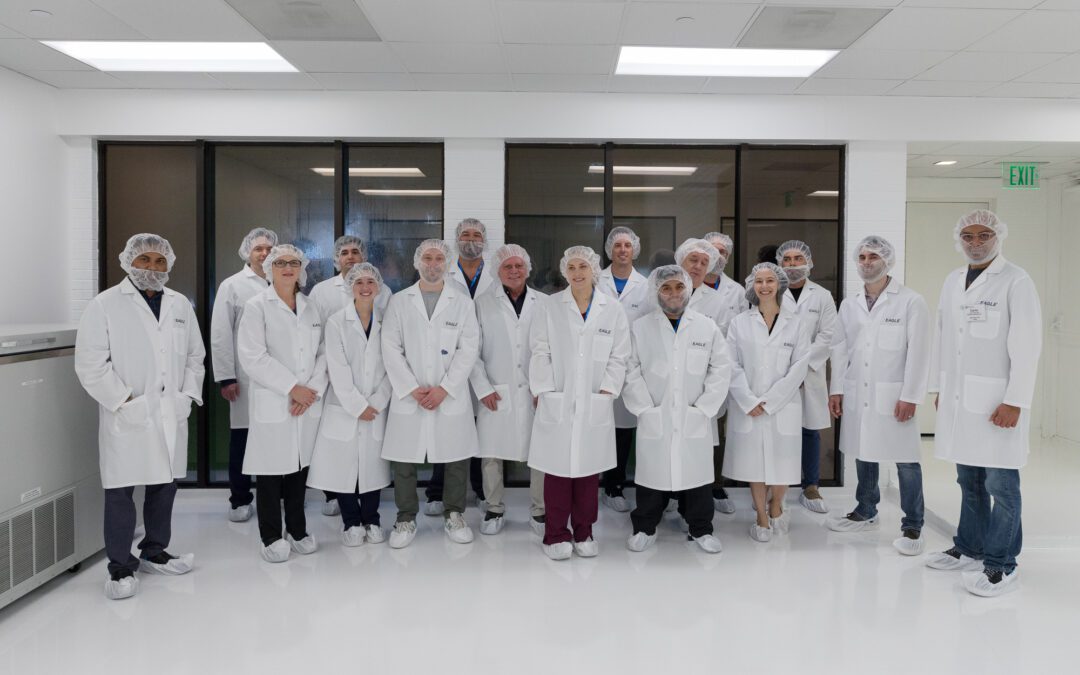 A group of PCCA Sterility Assurance trainees smile while touring Eagle's Houston, TX laboratory.