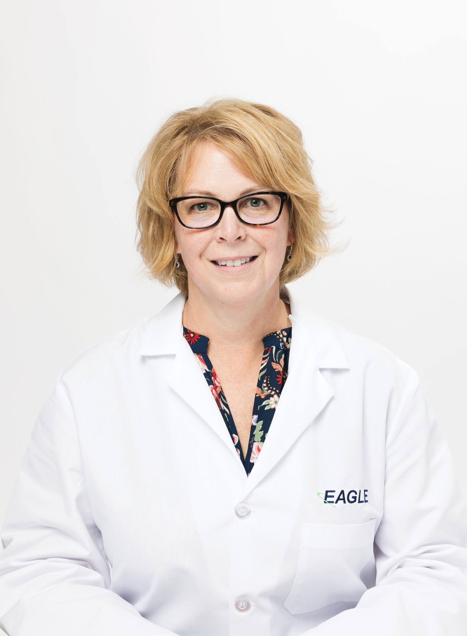 Microbiology Manager Melissa Stappen smiles while wearing a white Eagle lab coat.